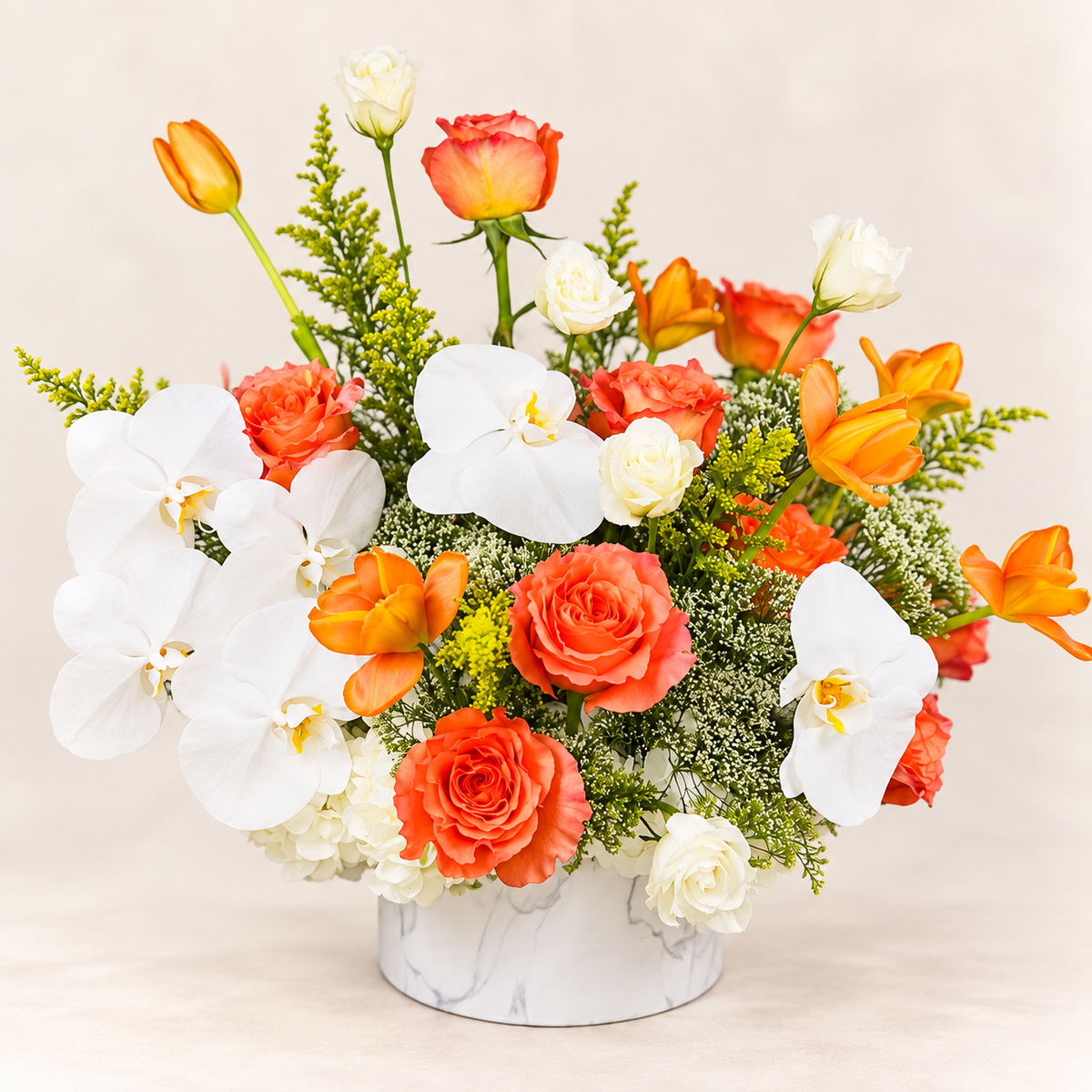 Orange and white floral arrangement with coral roses, white orchids, hydrangeas and seasonal flowers by AG Floral Studio in Miami