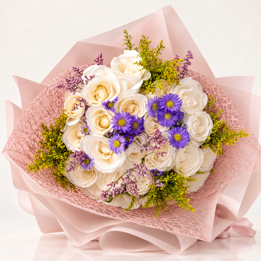 White rose bouquet with purple flowers and blush wrapping by AG Floral Studio in Miami